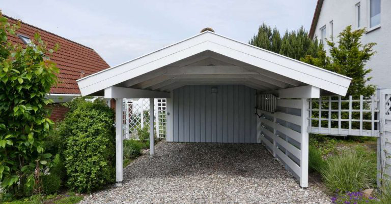 Freestanding Carport Freestanding carport with storage area and gravel parking
