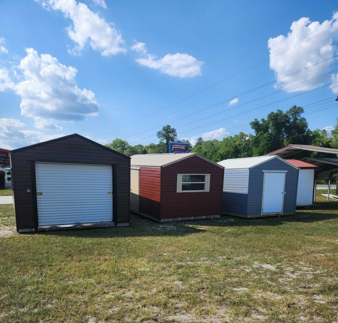 several sheds on the sales lot