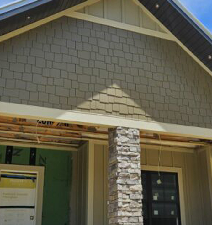 home with custom shaker shingle siding on the gable