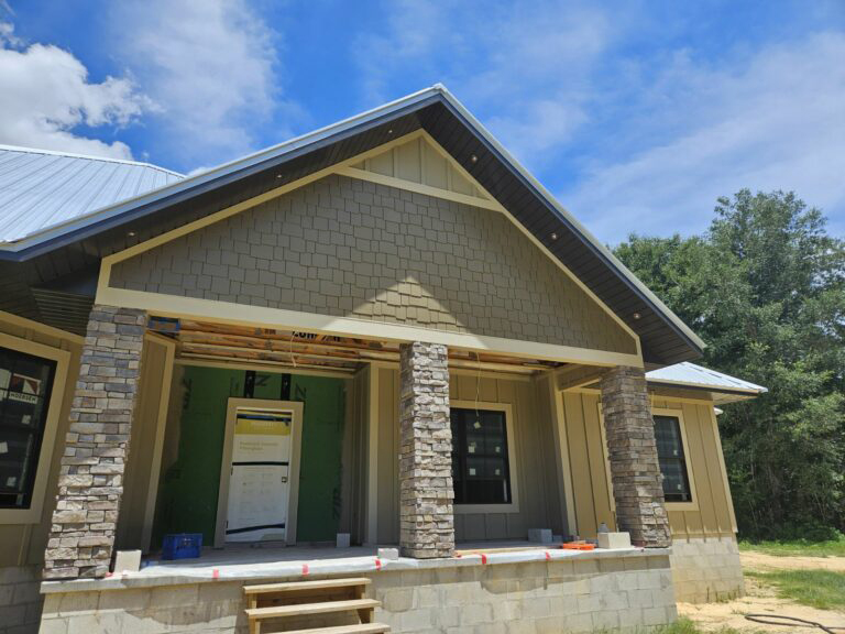 home with custom shaker shingle siding on the gable