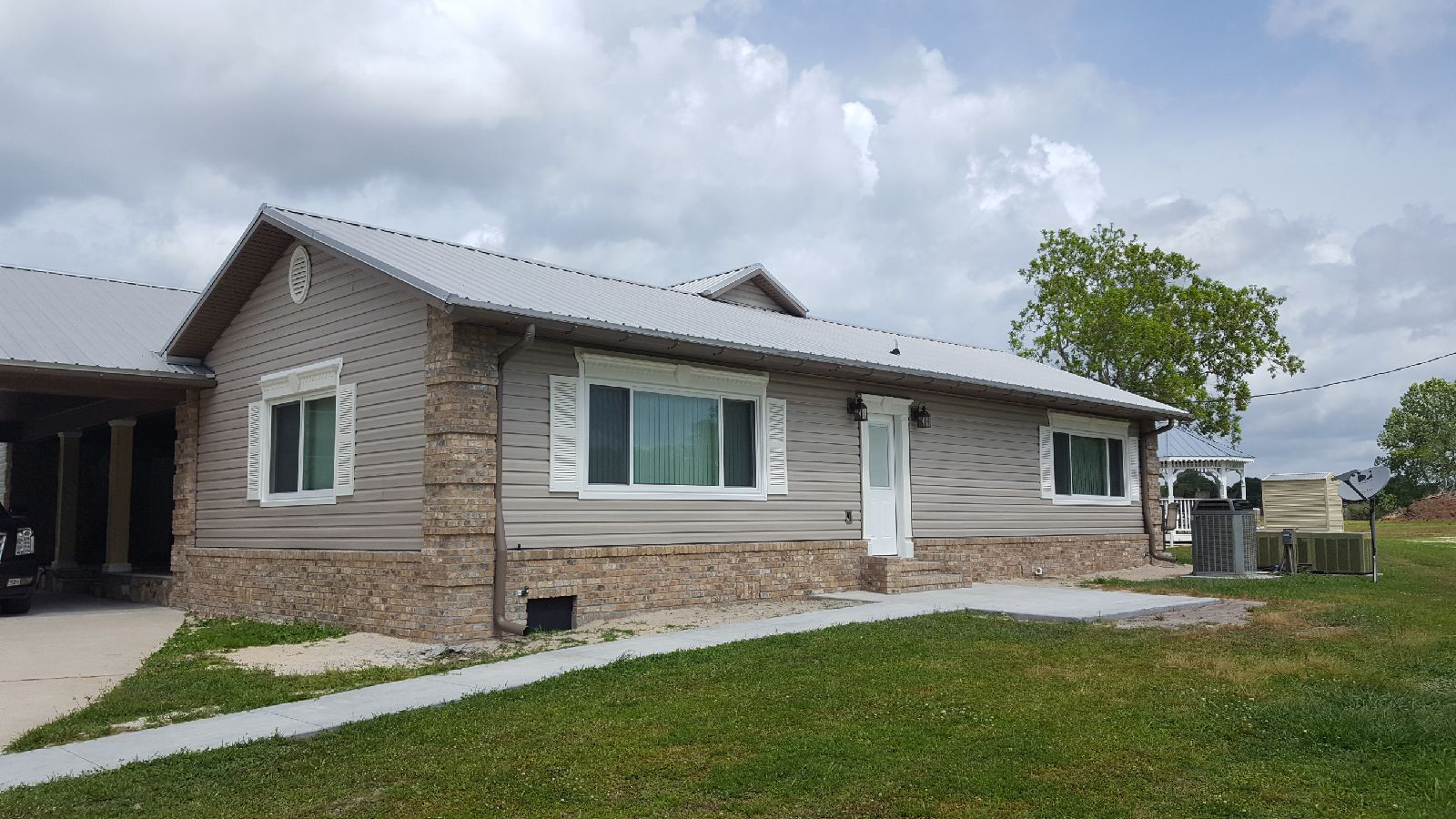 home with siding and custom gutters