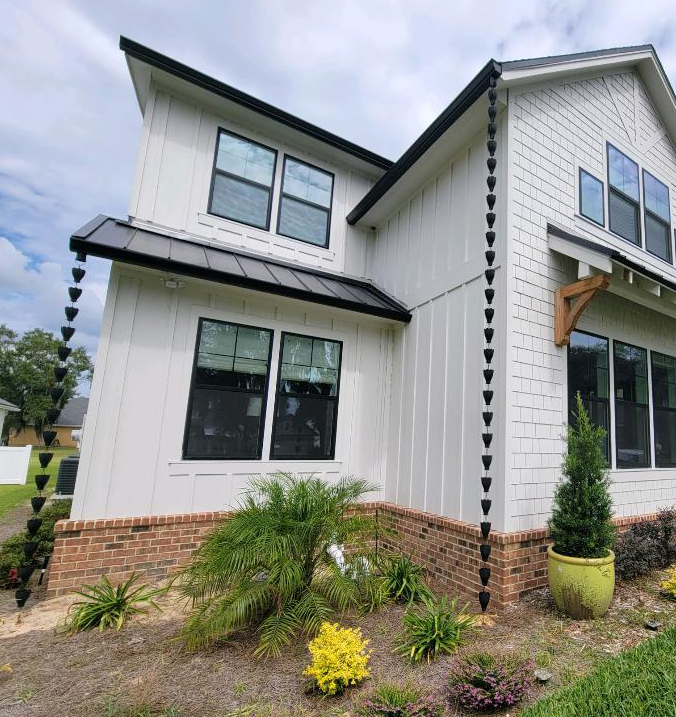 multi level home with two rain chains
