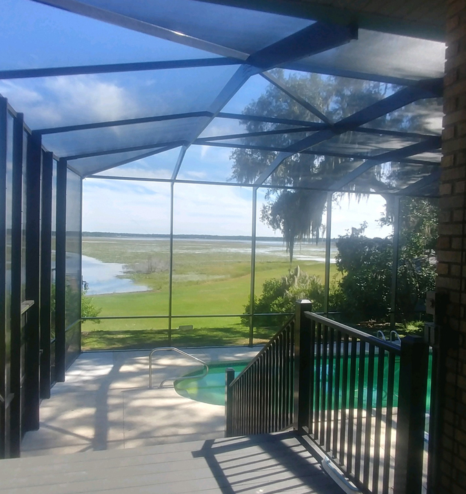 Screened Pool area overlooking a lake
