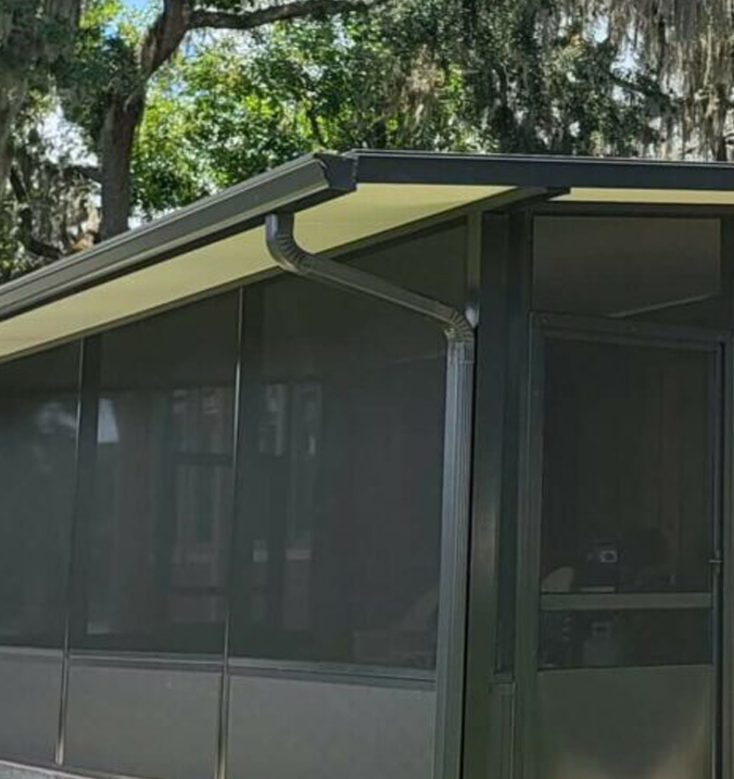 gutter on a screened porch under oak trees
